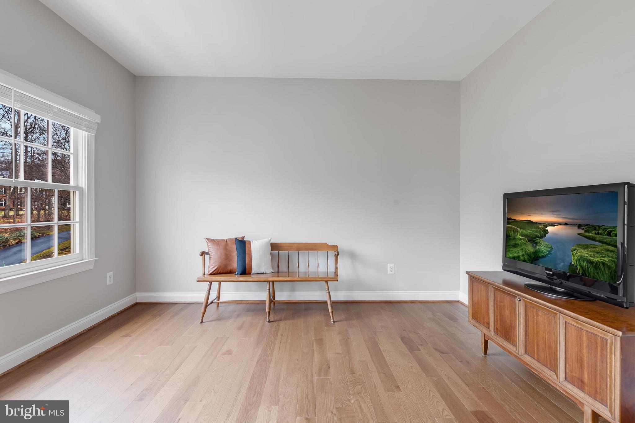1181 Hawling Place Southwest Leesburg, VA 20175 - Photo 30 of 66 a living room with furniture and a flat screen tv