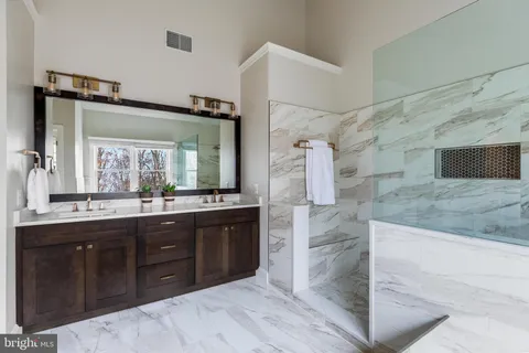 a bed room with a bed and a chair