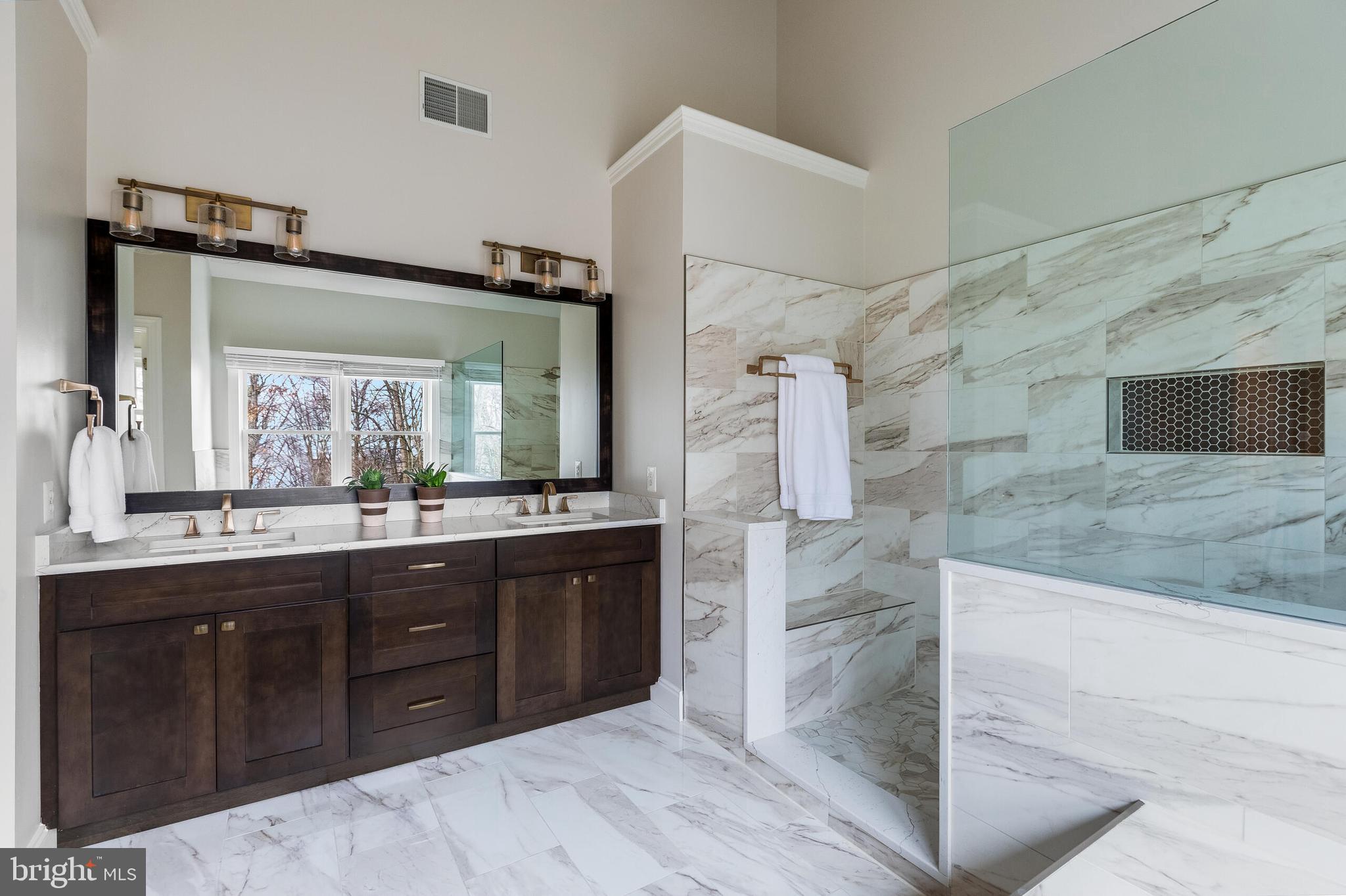 1181 Hawling Place Southwest Leesburg, VA 20175 - Photo 35 of 66 a large bathroom with a sink and a mirror