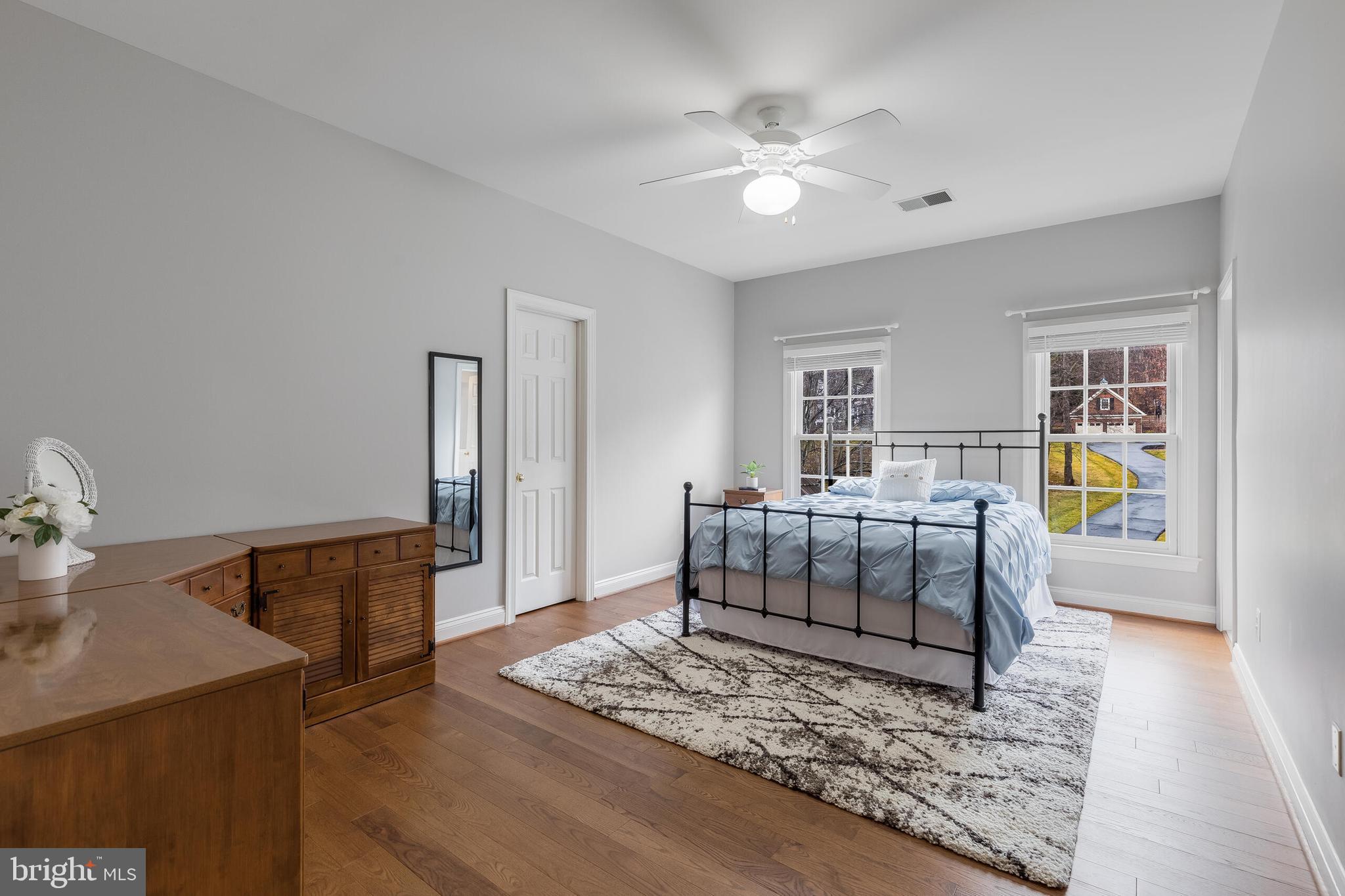 1181 Hawling Place Southwest Leesburg, VA 20175 - Photo 36 of 66 a bedroom with furniture and a wooden floor