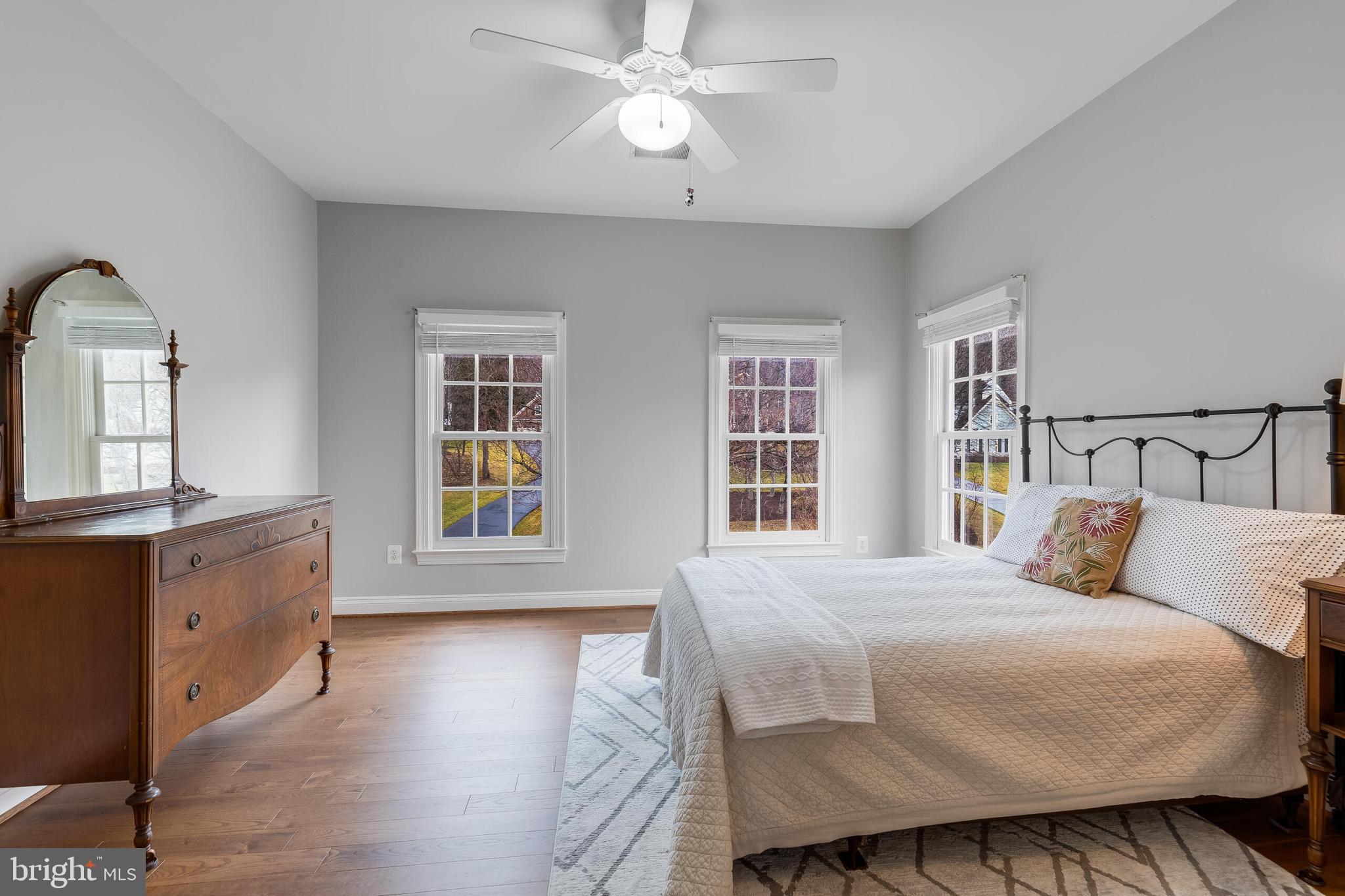 1181 Hawling Place Southwest Leesburg, VA 20175 - Photo 39 of 66 a bedroom with a large bed and a chandelier