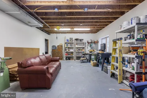 a view of a house with swimming pool and sitting area