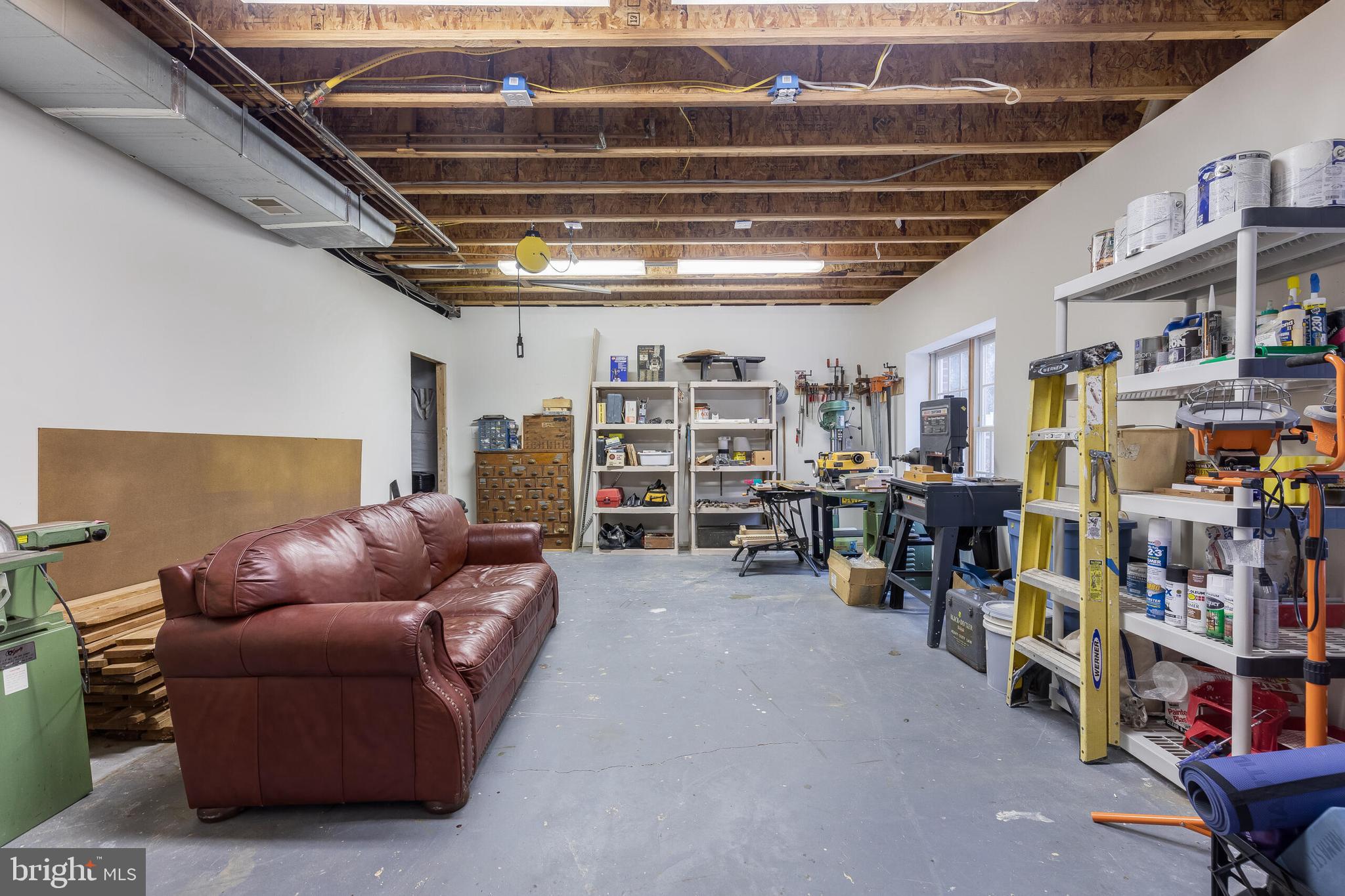 1181 Hawling Place Southwest Leesburg, VA 20175 - Photo 50 of 66 a living room with furniture and a large window