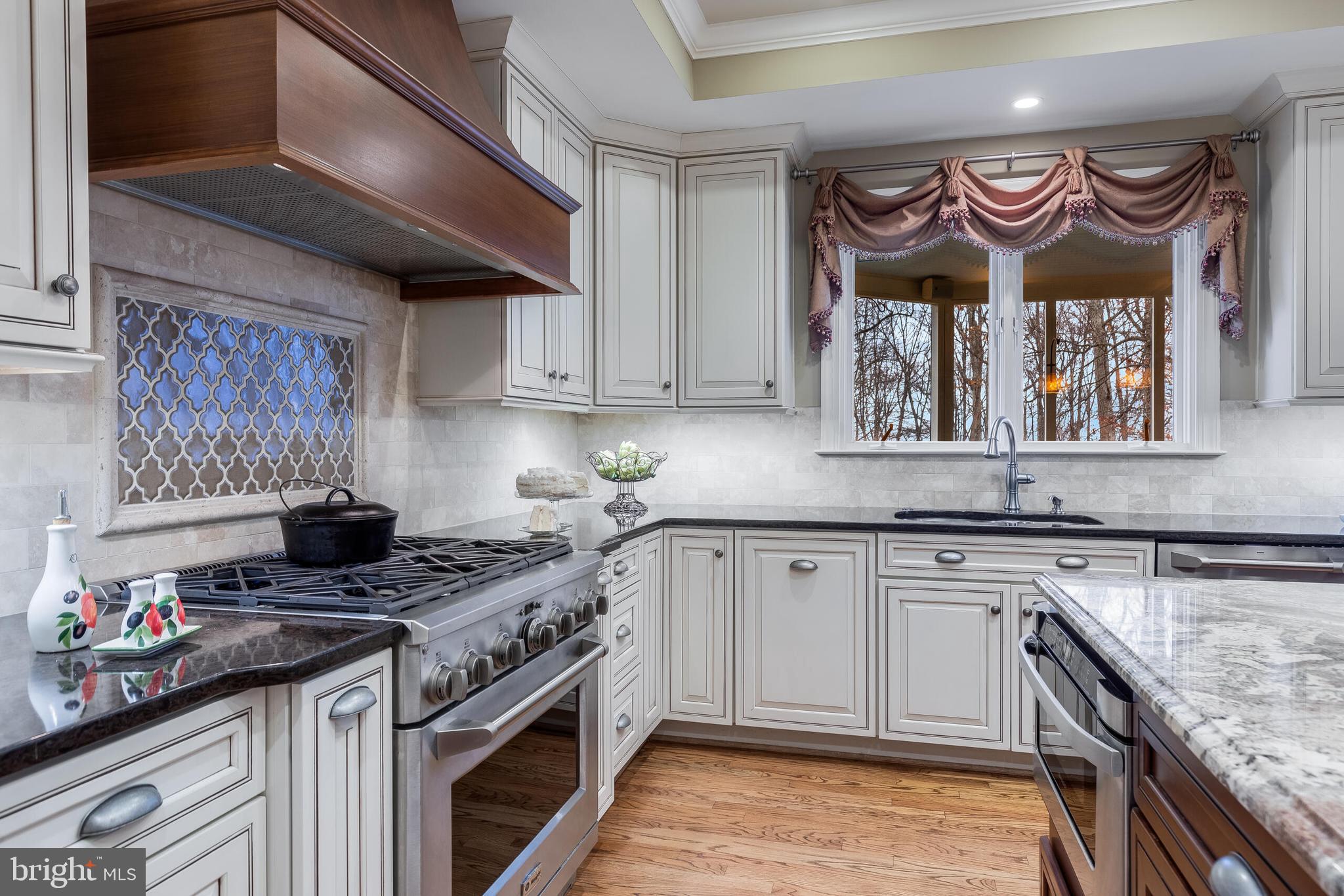 1181 Hawling Place Southwest Leesburg, VA 20175 - Photo 5 of 66 a kitchen with stainless steel appliances granite countertop a stove and a sink