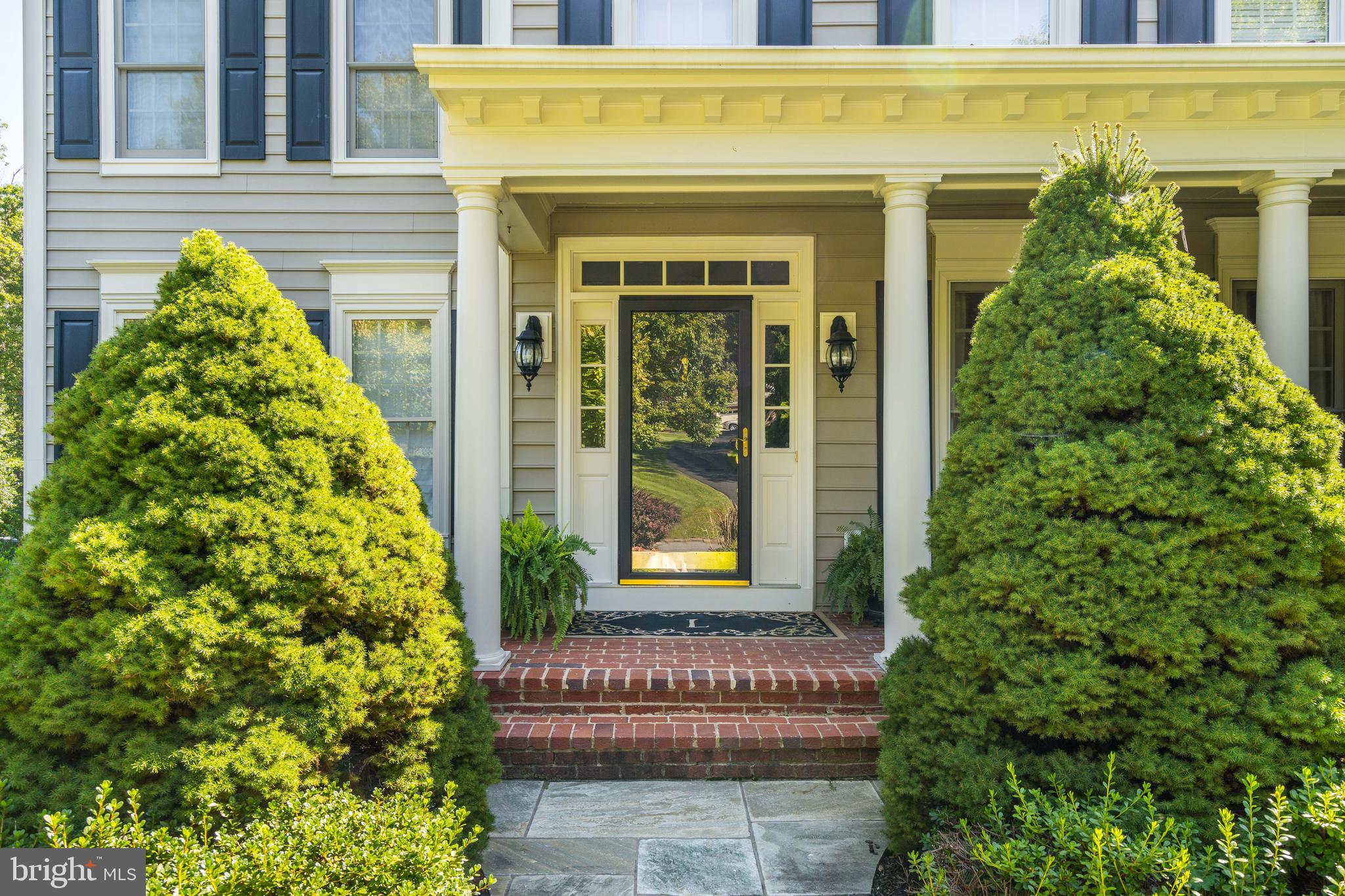 1181 Hawling Place Southwest Leesburg, VA 20175 - Photo 55 of 66 a front view of a house with a yard