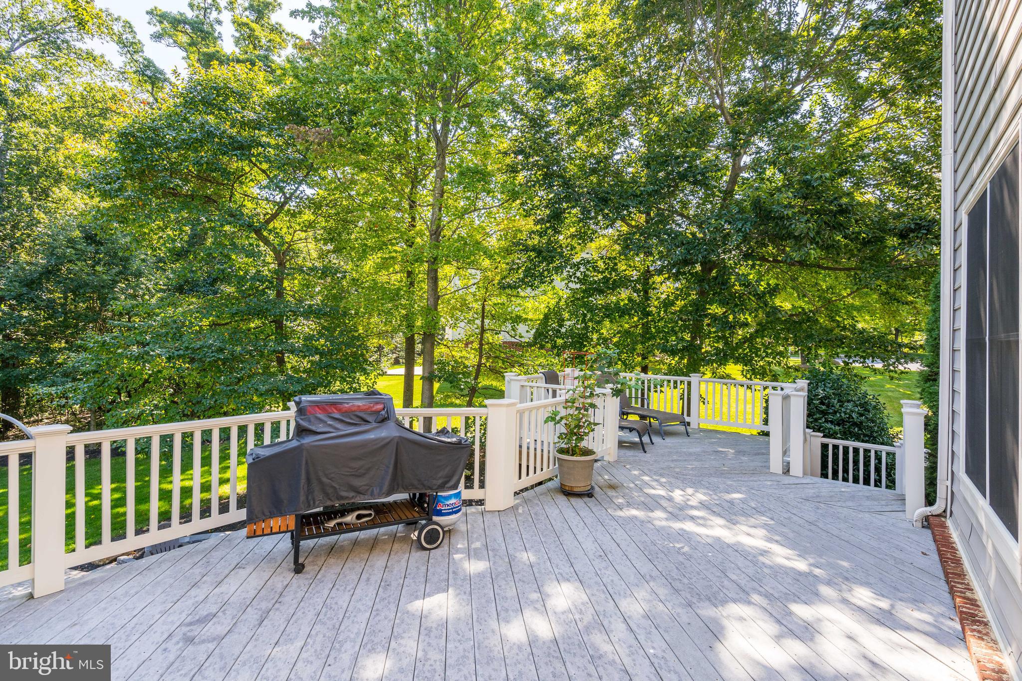 1181 Hawling Place Southwest Leesburg, VA 20175 - Photo 58 of 66 a view of backyard with a table and chairs with wooden fence and floor