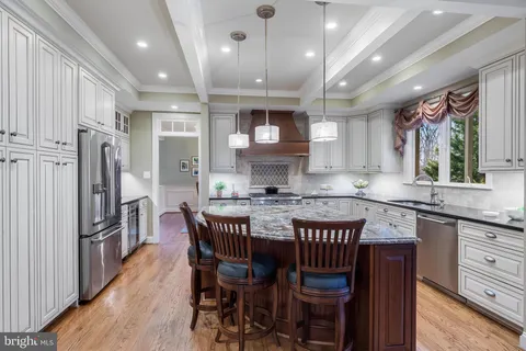 a kitchen with cabinets appliances and a counter top space