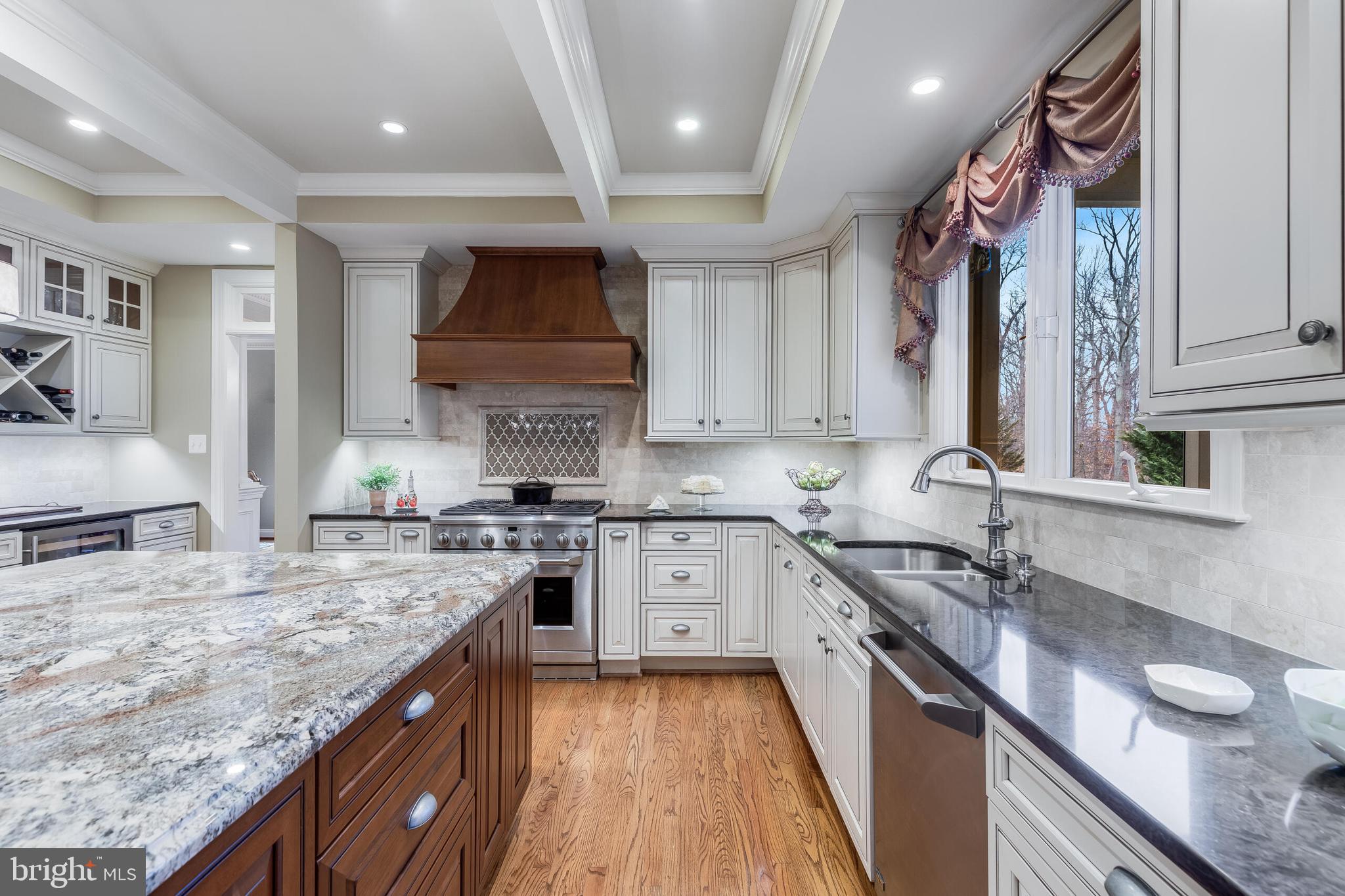 1181 Hawling Place Southwest Leesburg, VA 20175 - Photo 7 of 66 a kitchen with a sink stove and cabinets
