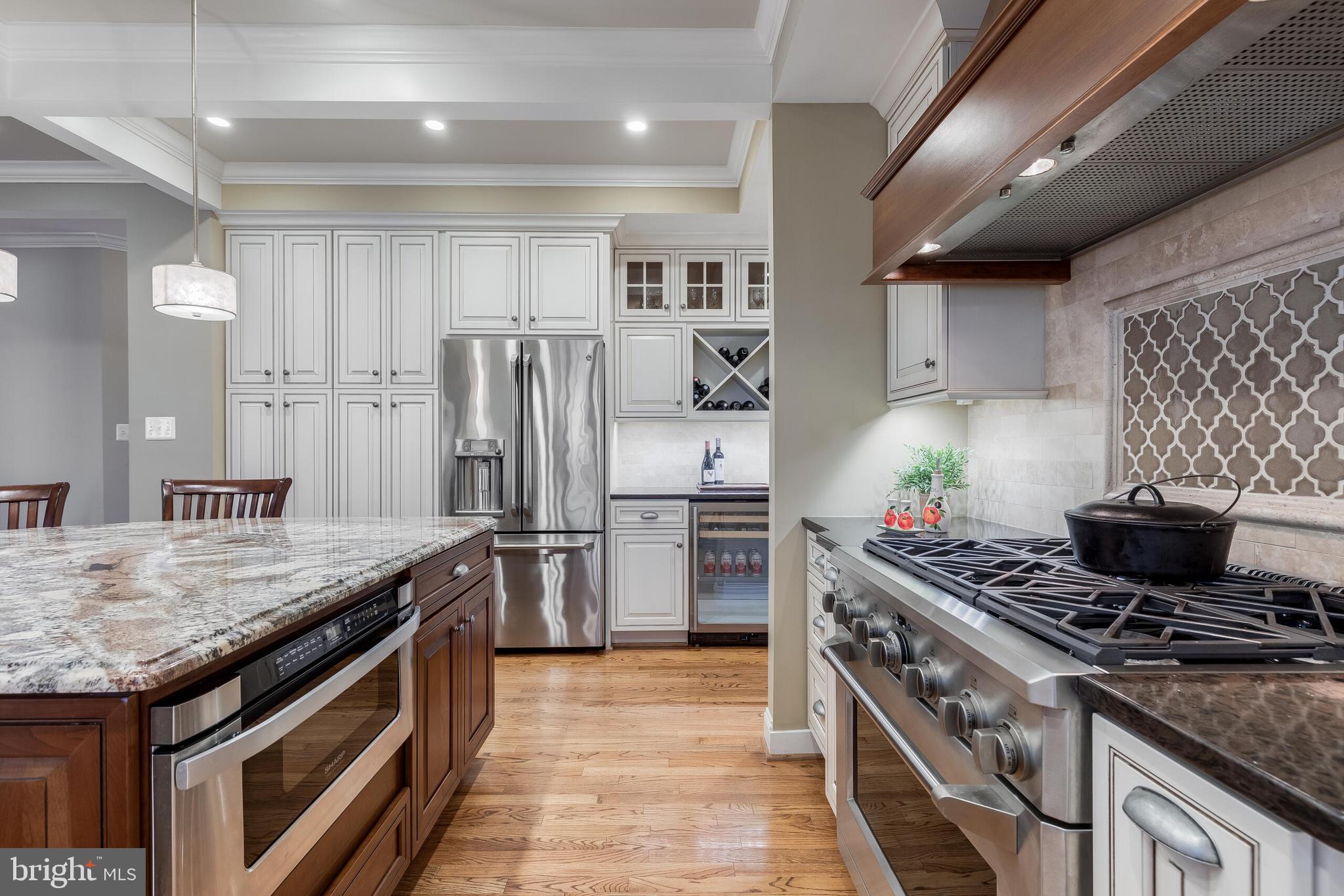 1181 Hawling Place Southwest Leesburg, VA 20175 - Photo 9 of 66 a kitchen with a stove and a refrigerator