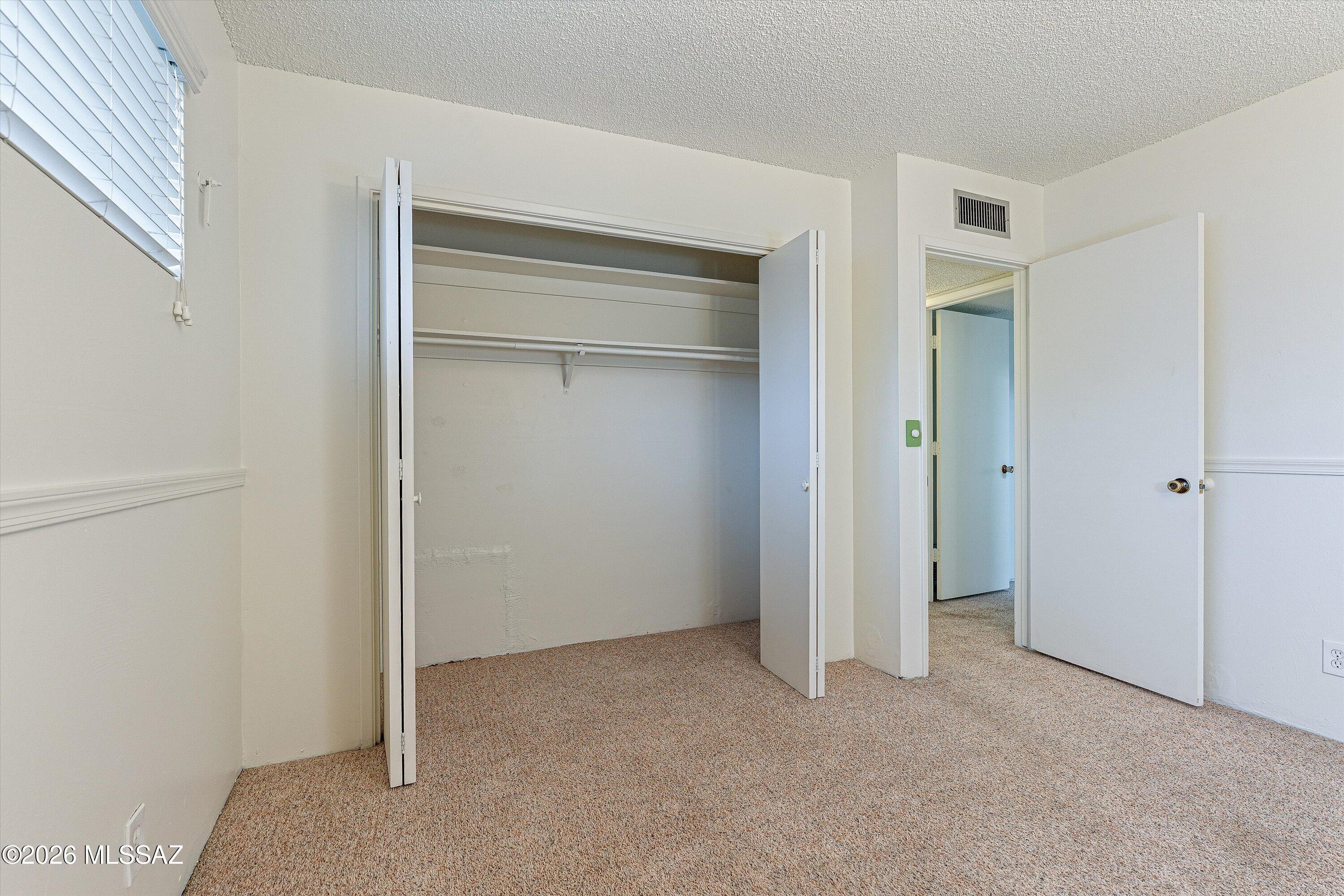 660 East River Road, Unit J Tucson, AZ 85704 - Photo 23 of 27 Bedroom 2