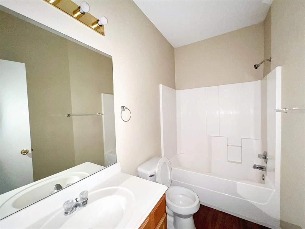 10416 Phantom Hill Road Fort Worth, TX 76140 - Photo 11 of 13 a bathroom with a sink a toilet and shower