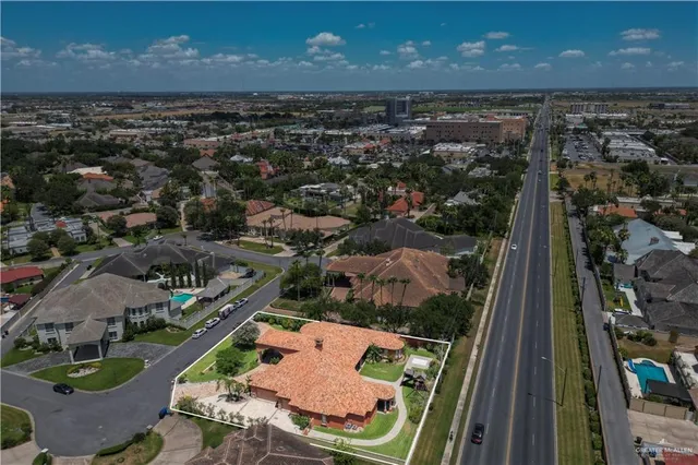 an aerial view of residential houses with outdoor space