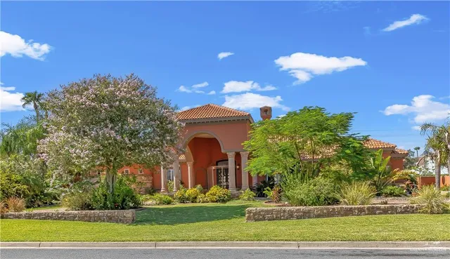 a front view of a house with garden