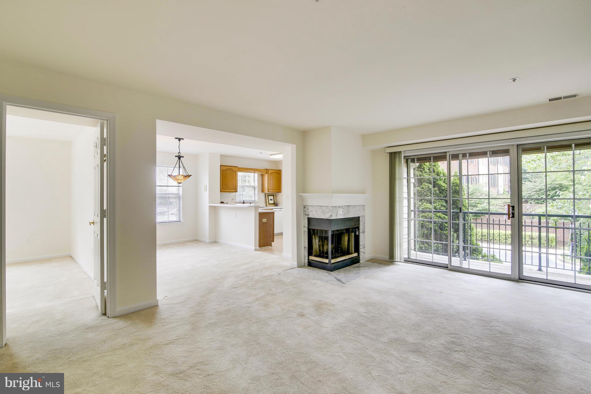 Living Room w/Fireplace & Door to Balcony