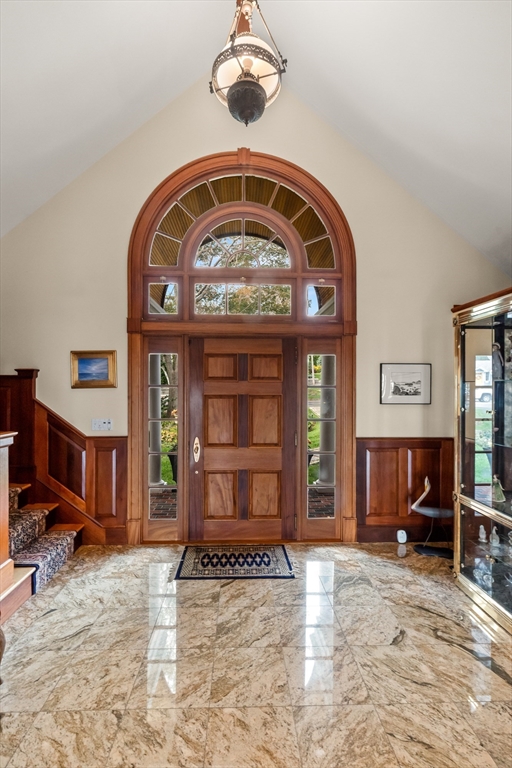 13 Phillips Avenue Rockport, MA 01966 - Photo 11 of 39 a view of a livingroom with a fireplace a bedroom and windows