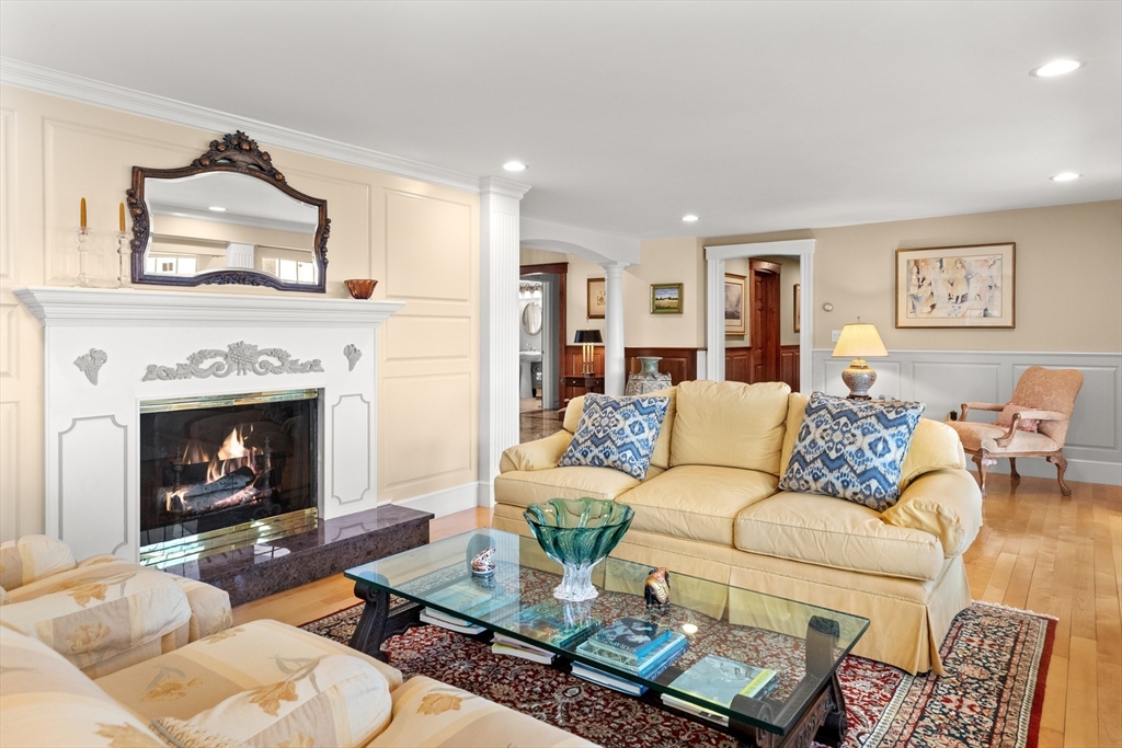 13 Phillips Avenue Rockport, MA 01966 - Photo 13 of 39 a living room with furniture a fireplace a rug and a window