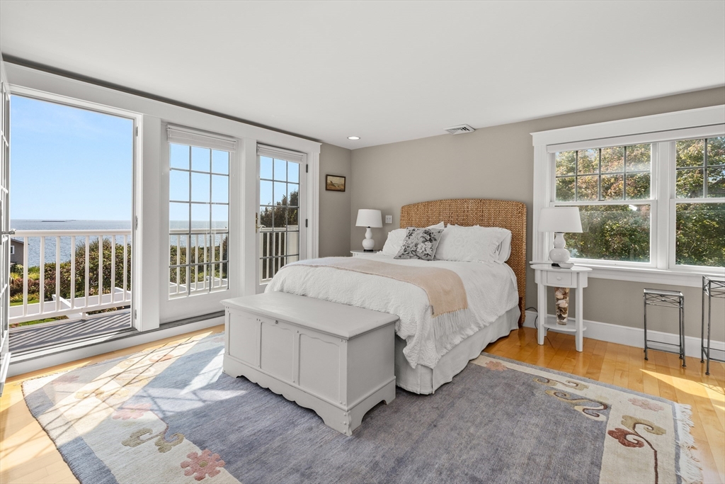 13 Phillips Avenue Rockport, MA 01966 - Photo 24 of 39 a spacious bedroom with a bed and a large window