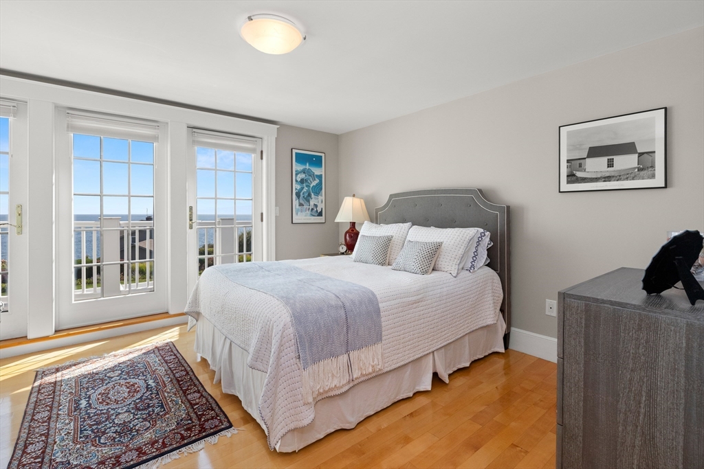 13 Phillips Avenue Rockport, MA 01966 - Photo 28 of 39 a bedroom with a bed and a window