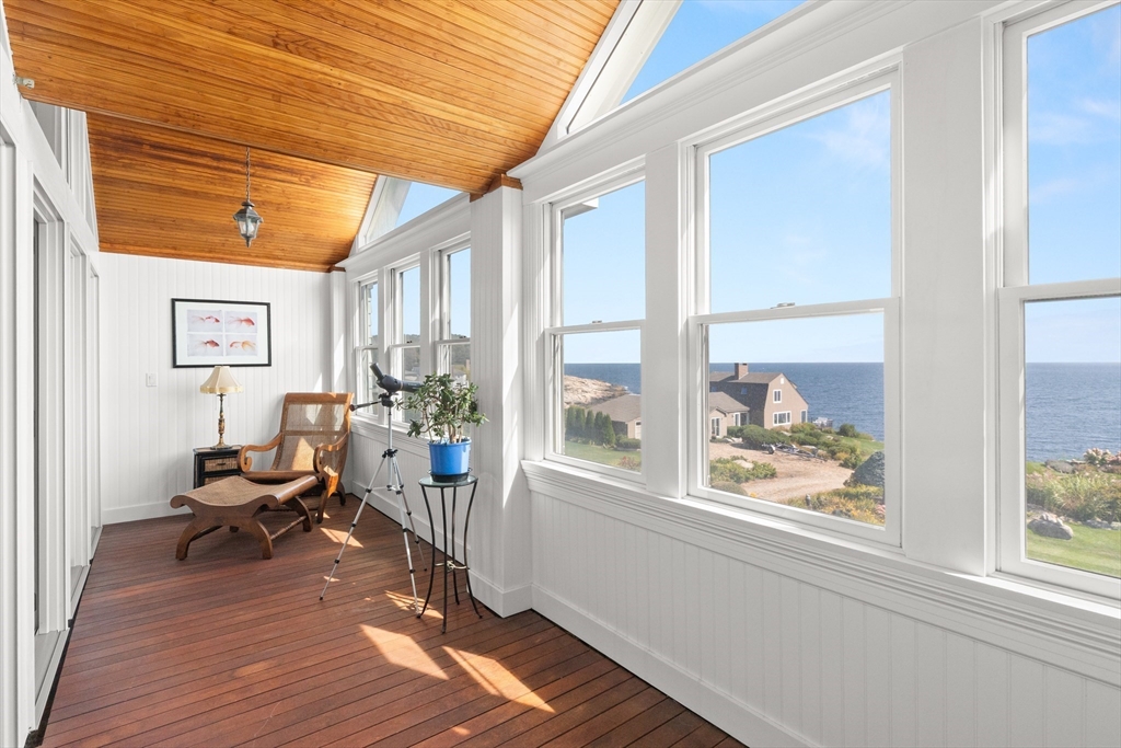 13 Phillips Avenue Rockport, MA 01966 - Photo 32 of 39 a living room with furniture a wooden floor and a large window