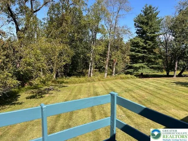 a view of swimming pool with outdoor seating