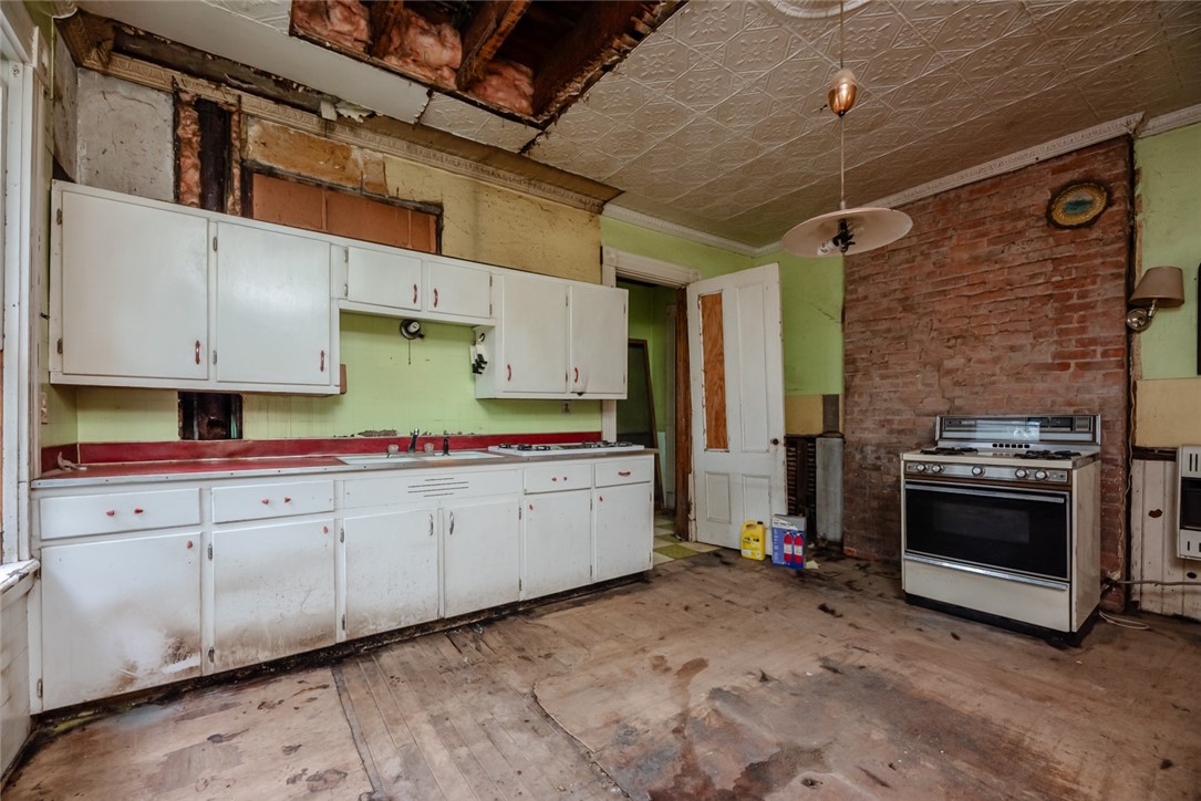 82 Harper Street Rochester, NY 14607 - Photo 13 of 46 Just imagine, subway tile and fresh cabinets! Take