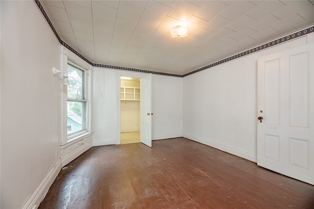 82 Harper Street Rochester, NY 14607 - Photo 23 of 46 A walk-in closet completes this large bedroom.