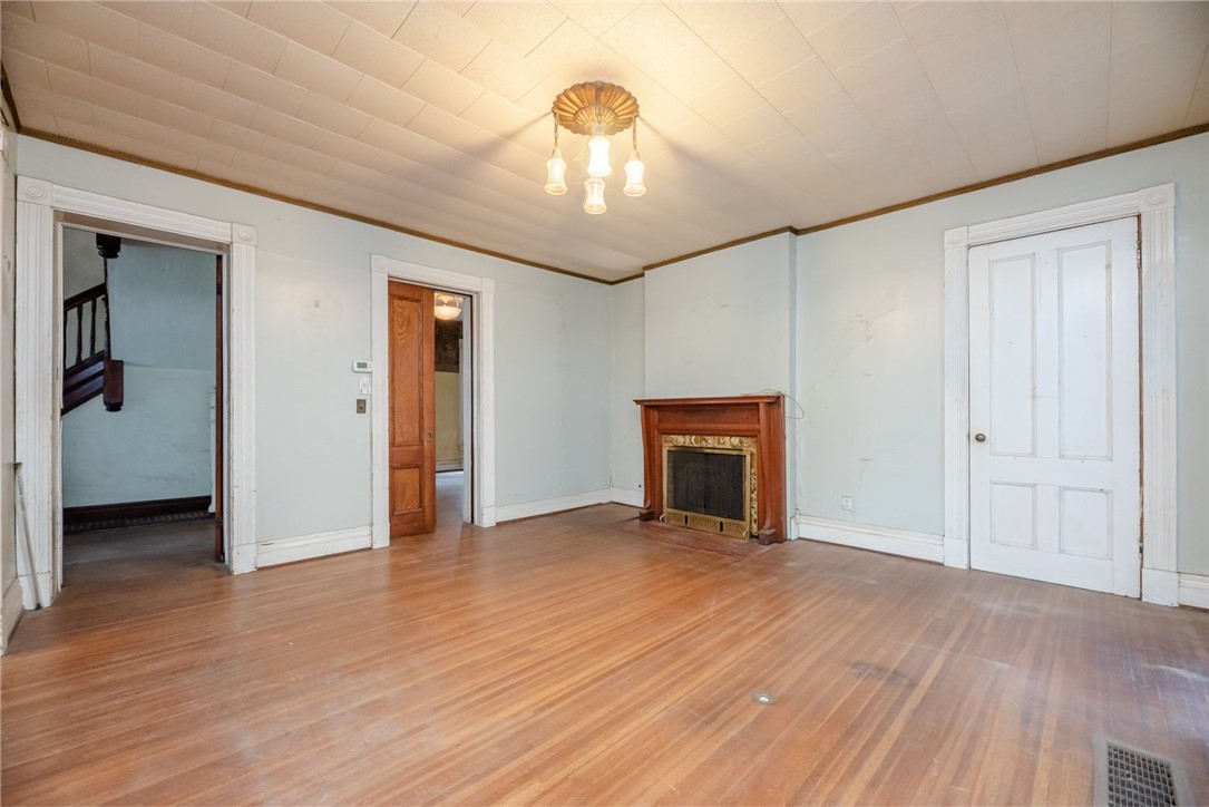 82 Harper Street Rochester, NY 14607 - Photo 33 of 46 Entertain in the large family room - original fire