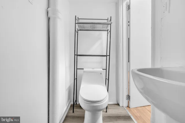 a bathroom with a toilet and a bathtub