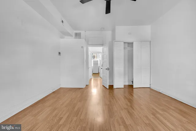 a view of an empty room with a window