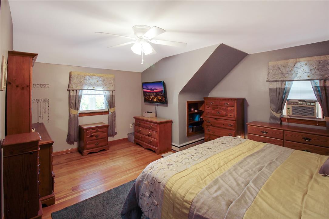 1256 Ridge Avenue Whitehall, PA 18052 - Photo 29 of 43 Hardwood floors and sloped ceilings define this cozy bedroom retreat.