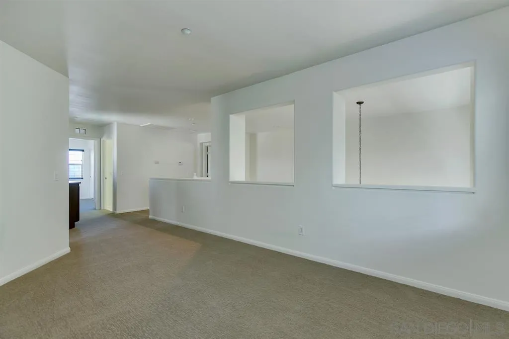 10472 Celestial Waters Drive Spring Valley, CA 91977 - Photo 12 of 24 an empty room with windows and closet