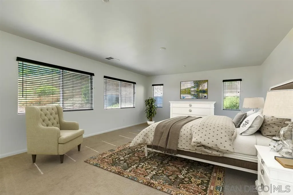 10472 Celestial Waters Drive Spring Valley, CA 91977 - Photo 15 of 24 a bedroom with a bed and a couch