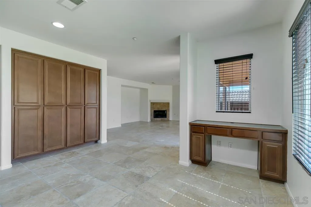 10472 Celestial Waters Drive Spring Valley, CA 91977 - Photo 10 of 24 a view of an empty room with window and stairs