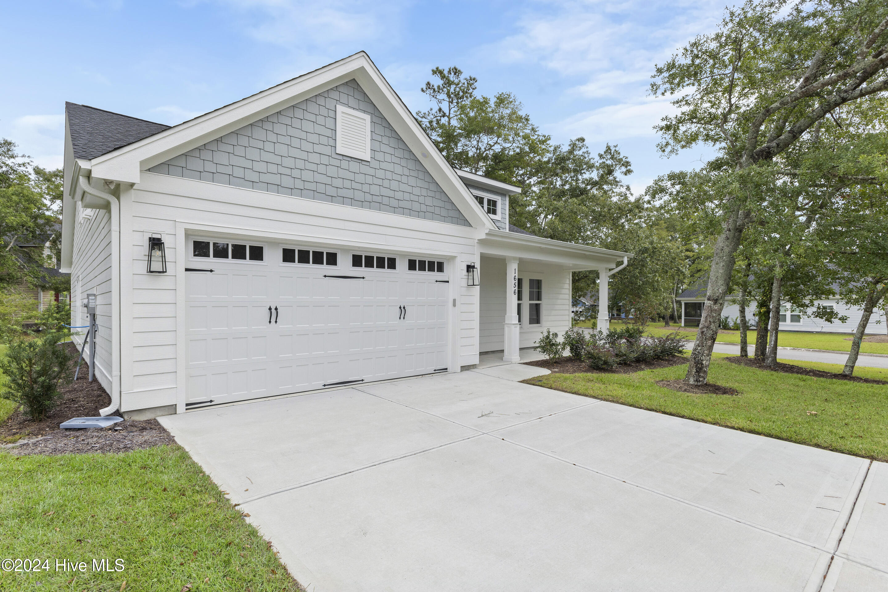 1656 Winding Way Southwest Ocean Isle Beach, NC 28469 - Photo 2 of 49 2 car garage and great front yard