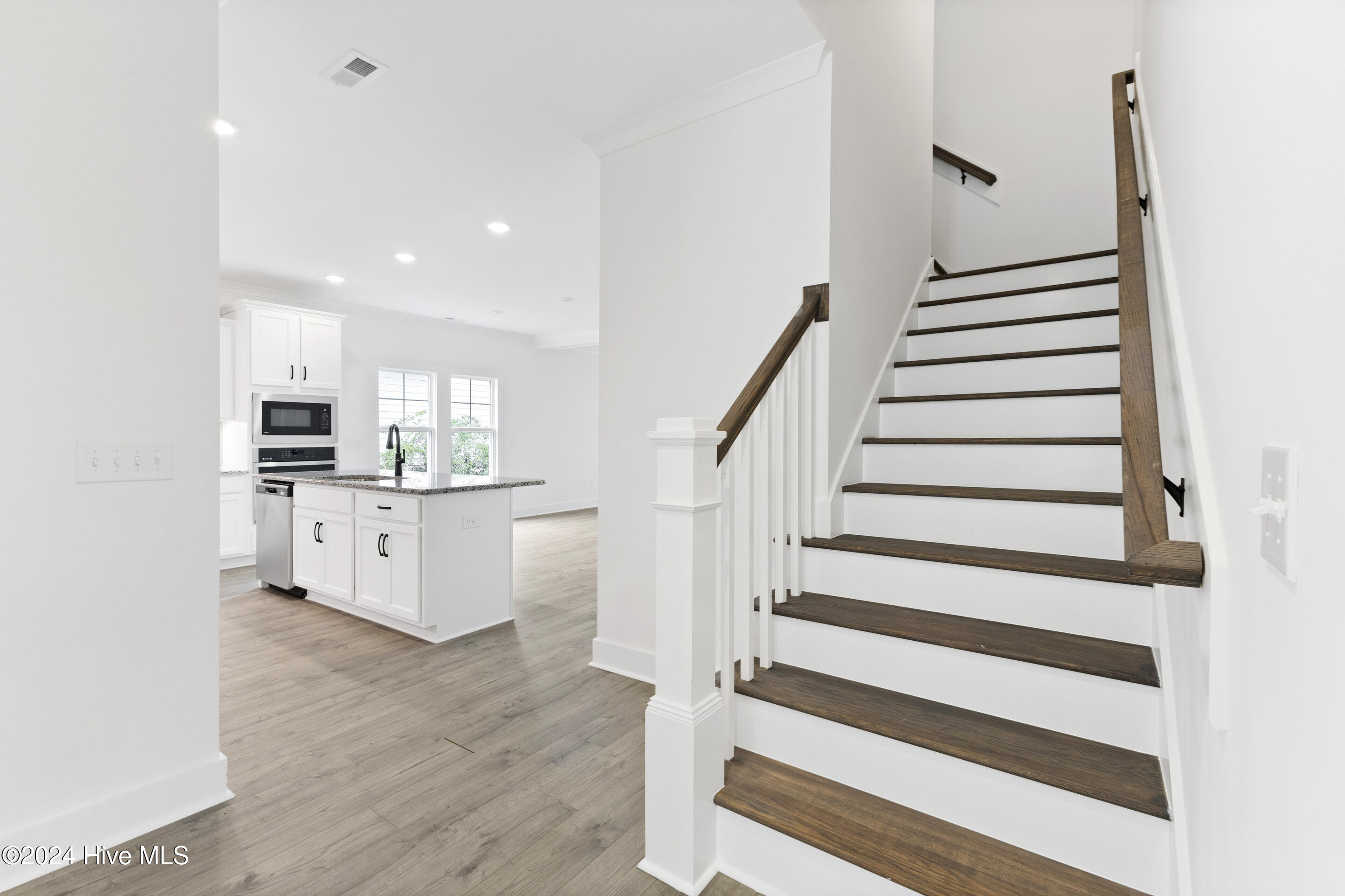 1656 Winding Way Southwest Ocean Isle Beach, NC 28469 - Photo 29 of 49 Stairs leading to the bonus room and bedroom