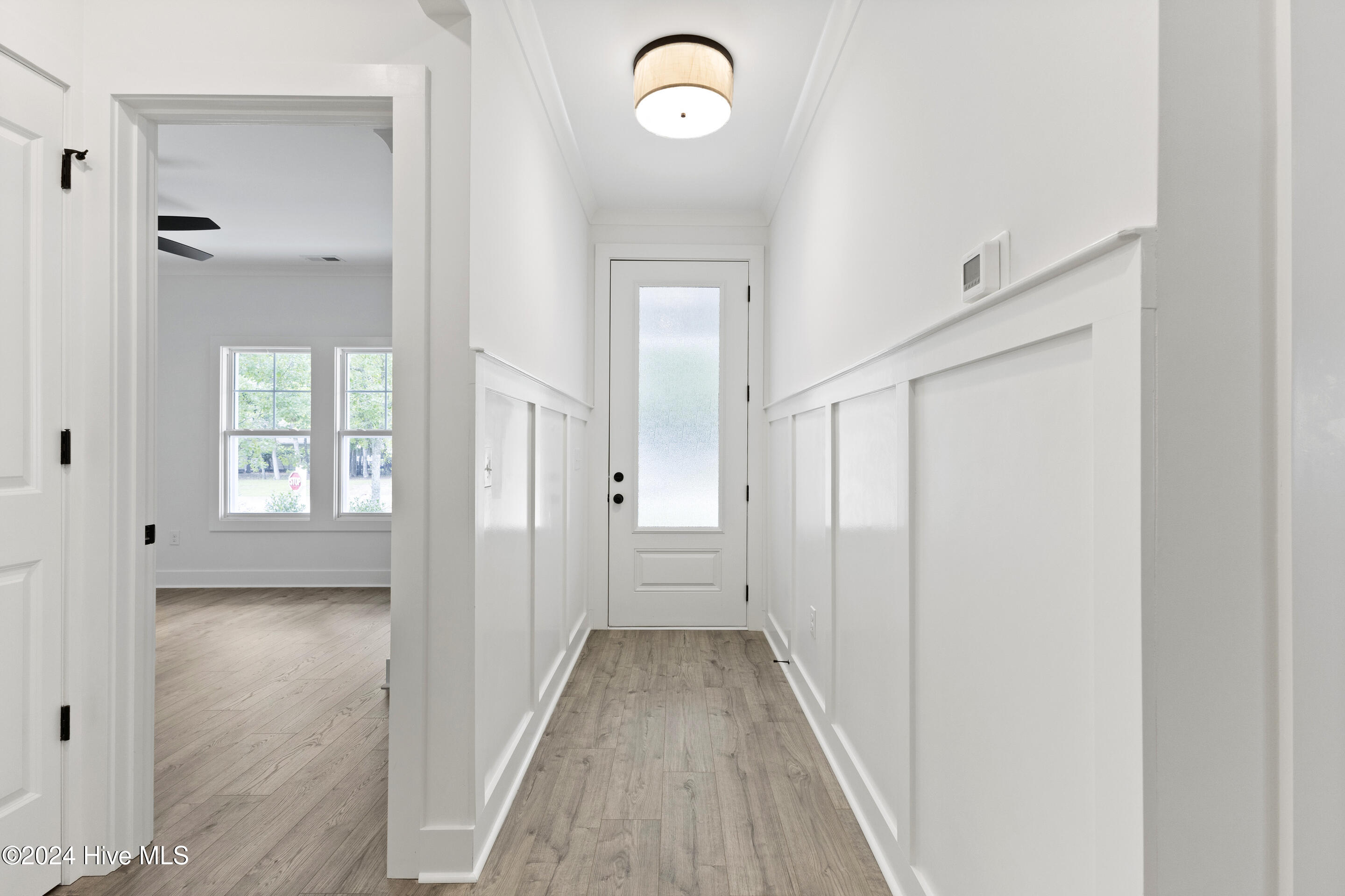 1656 Winding Way Southwest Ocean Isle Beach, NC 28469 - Photo 5 of 49 Foyer with trim and wood working details