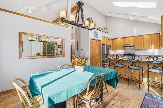 a view of a dining room with furniture window and outside view