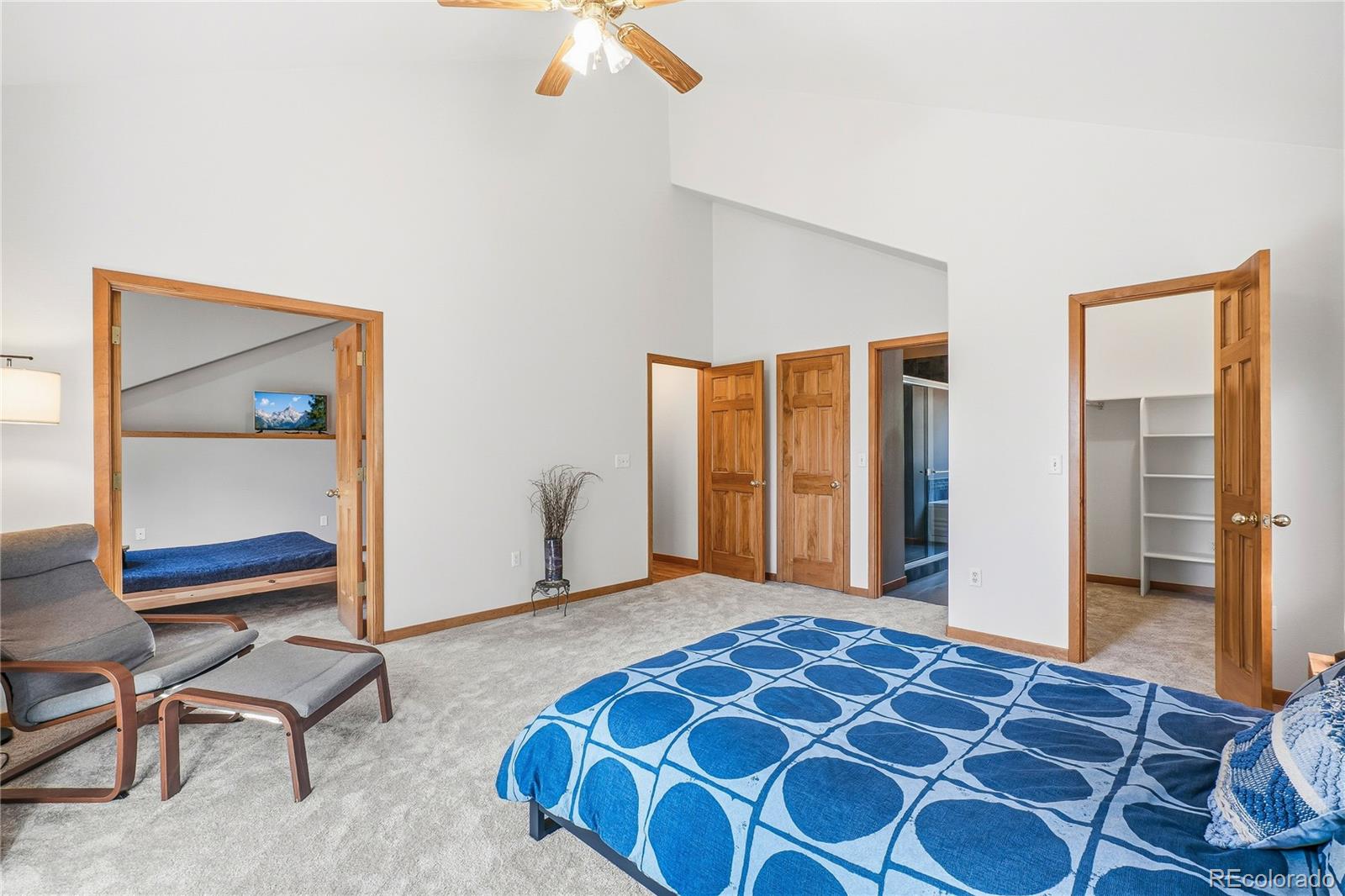 9274 Sandy Lane Conifer, CO 80433 - Photo 19 of 48 a bedroom with a bed and a table