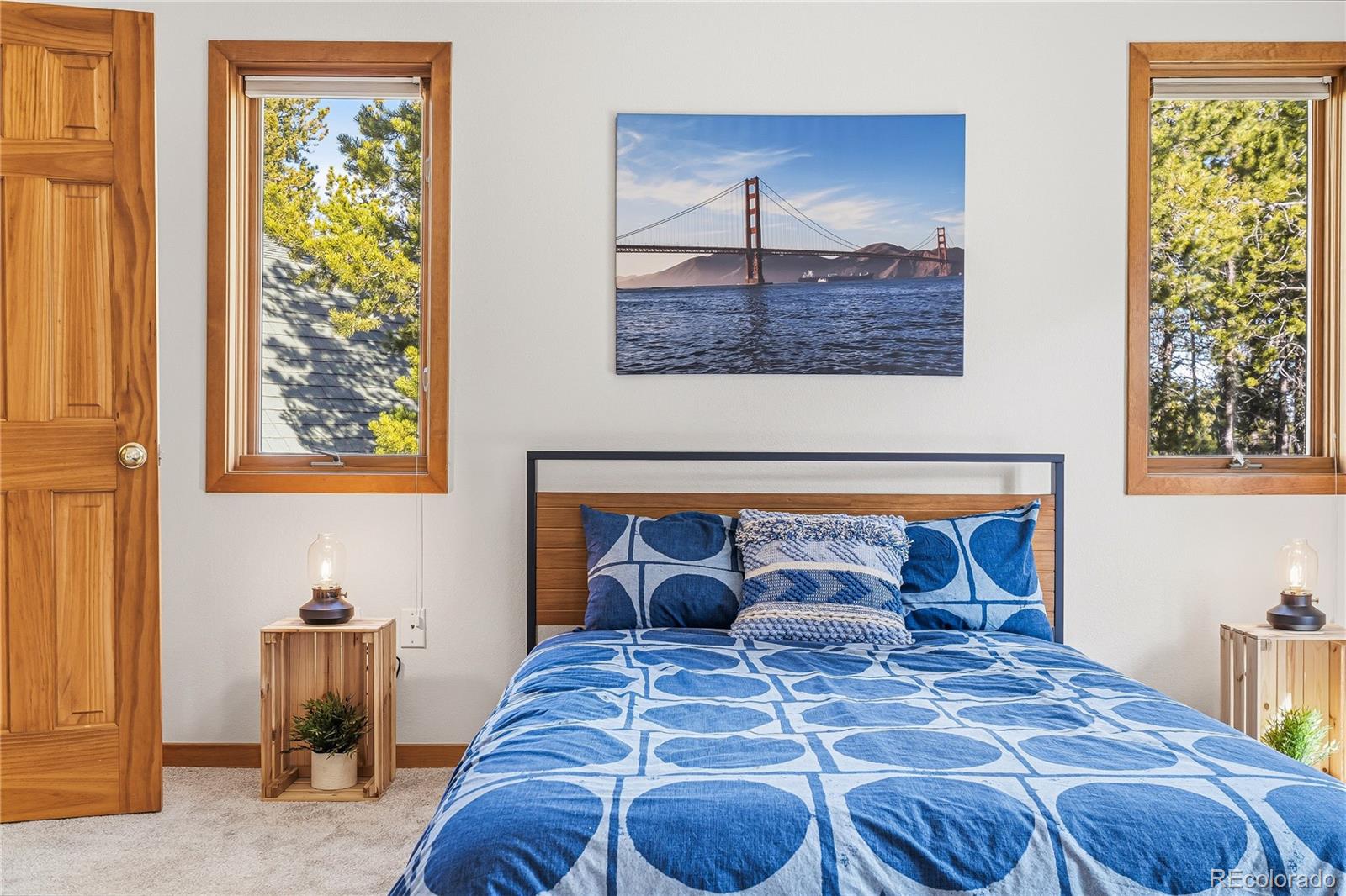 9274 Sandy Lane Conifer, CO 80433 - Photo 20 of 48 a bed room with a bed and a painting