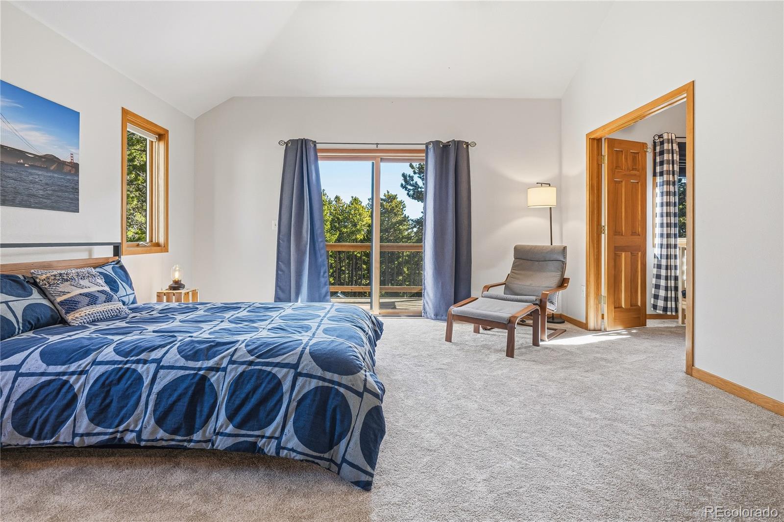 9274 Sandy Lane Conifer, CO 80433 - Photo 21 of 48 a bedroom with a bed and a window