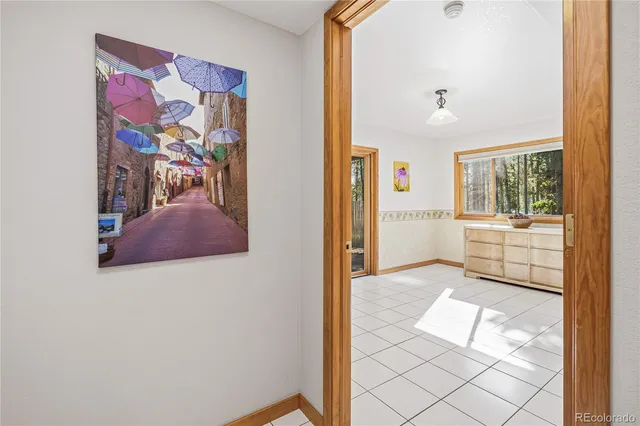 a view of a livingroom with furniture and a window