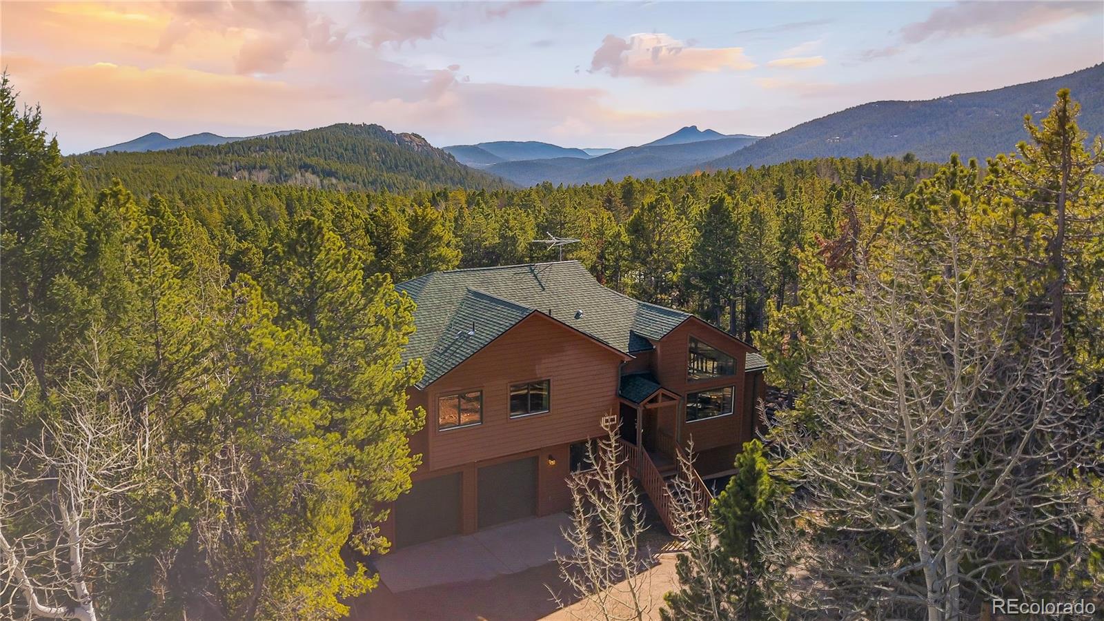 9274 Sandy Lane Conifer, CO 80433 - Photo 46 of 48 a view of a house with a mountain