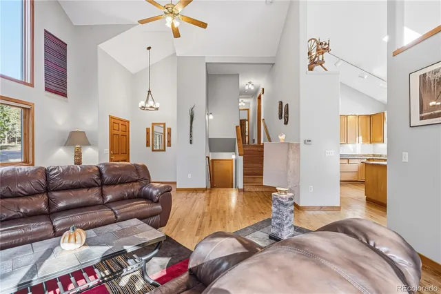 a living room with furniture and a table