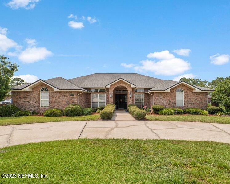 10079 Pebble Ridge Drive North Jacksonville, FL 32220 - Photo 1 of 32 a front view of a house with a yard