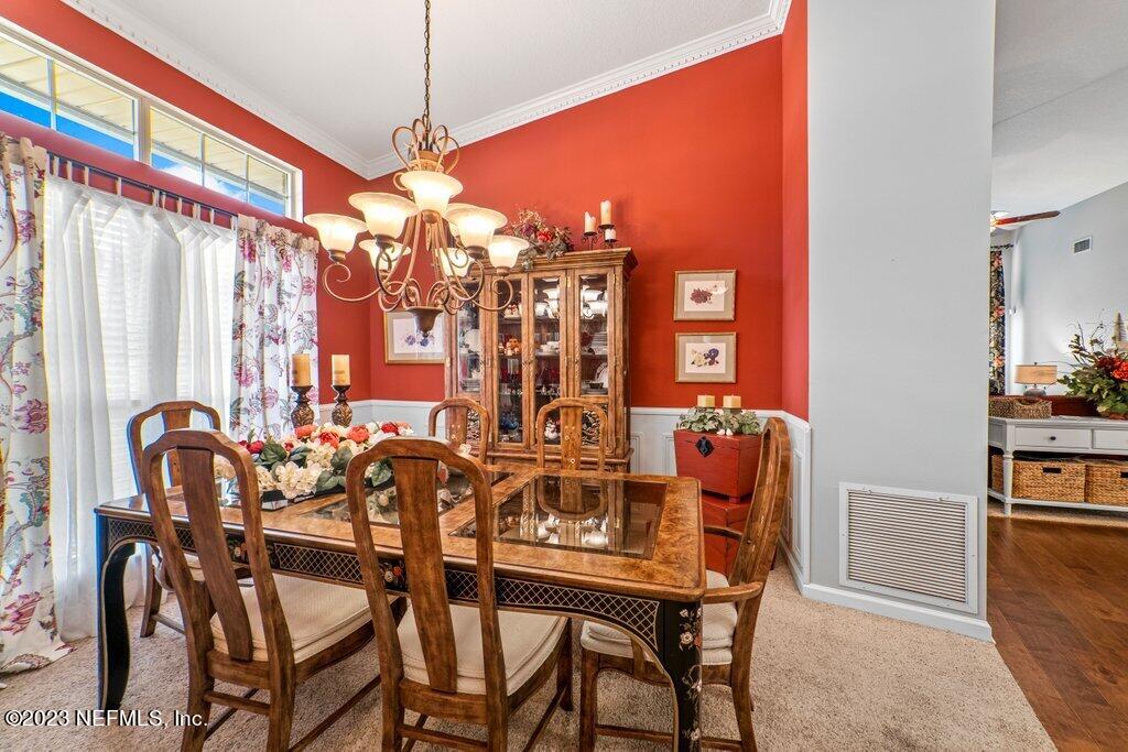 10079 Pebble Ridge Drive North Jacksonville, FL 32220 - Photo 11 of 32 a dining room with furniture and window