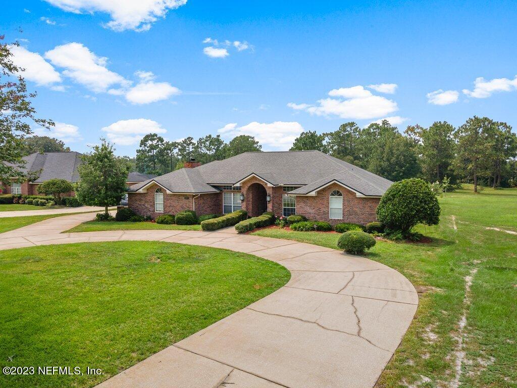 10079 Pebble Ridge Drive North Jacksonville, FL 32220 - Photo 2 of 32 a front view of a house with a yard