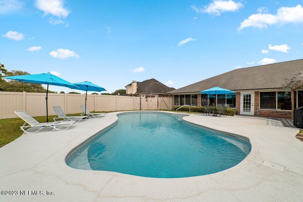 10079 Pebble Ridge Drive North Jacksonville, FL 32220 - Photo 26 of 32 a view of a house with pool