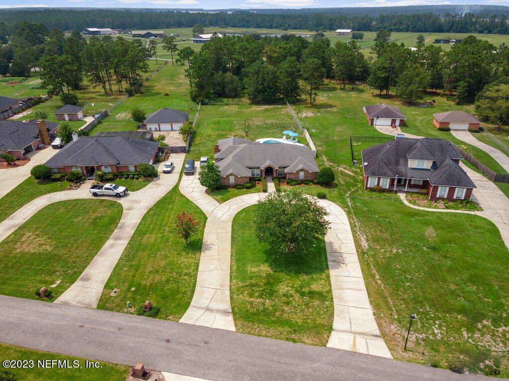 10079 Pebble Ridge Drive North Jacksonville, FL 32220 - Photo 31 of 32 an aerial view of a house with garden space ocean view and swimming pool