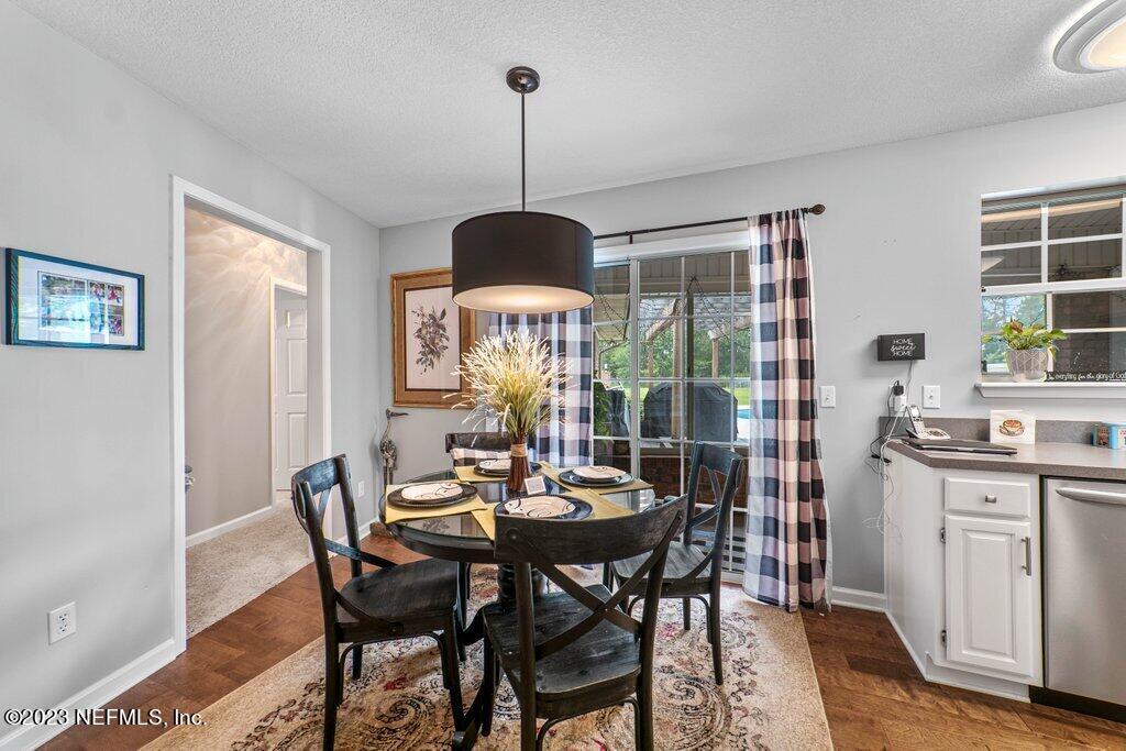 10079 Pebble Ridge Drive North Jacksonville, FL 32220 - Photo 8 of 32 a view of a dining room with furniture window and wooden floor