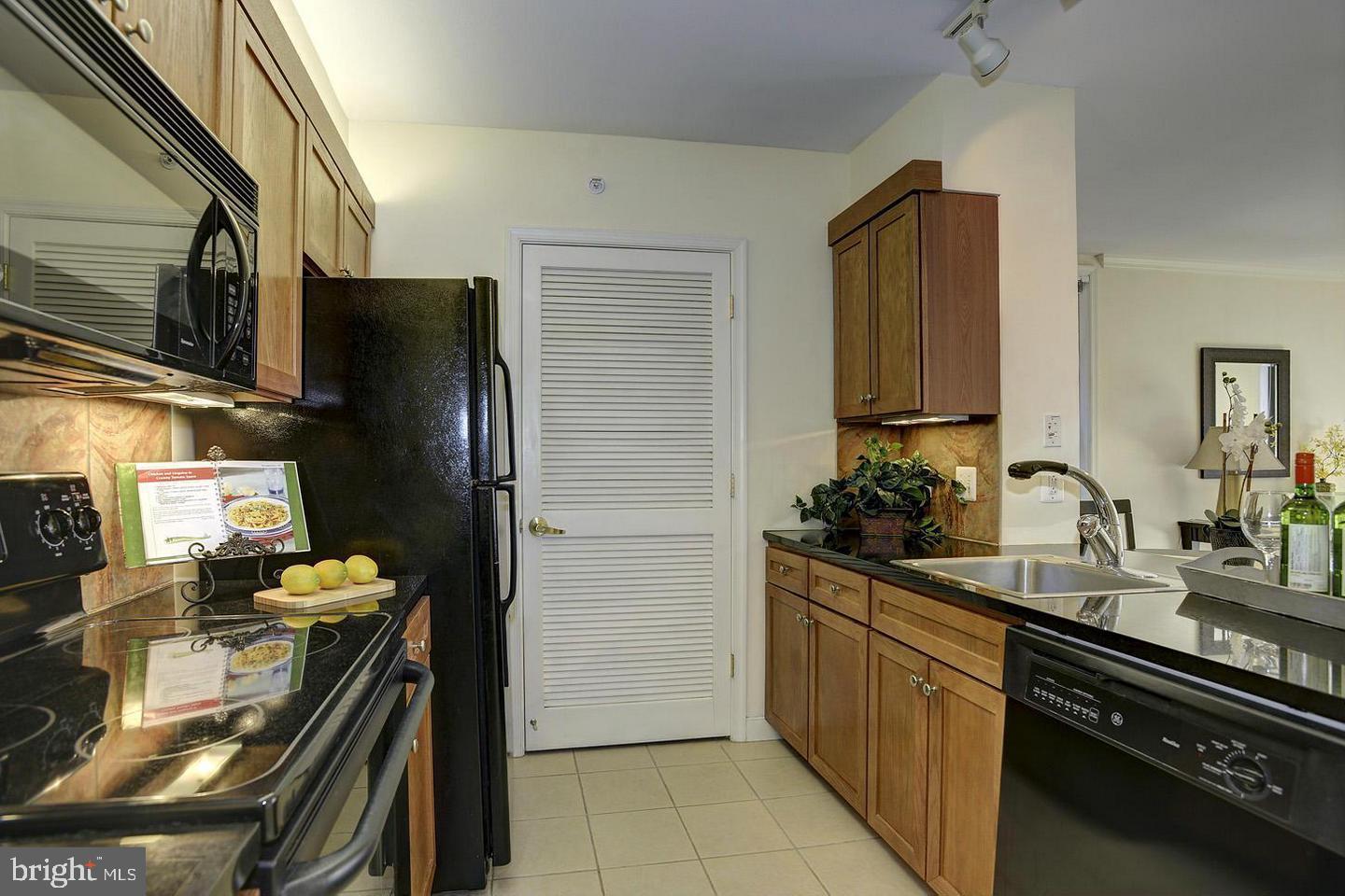 631 D Street Northwest, Unit 626 Washington, DC 20004 - Photo 6 of 19 a kitchen with a sink appliances and cabinets